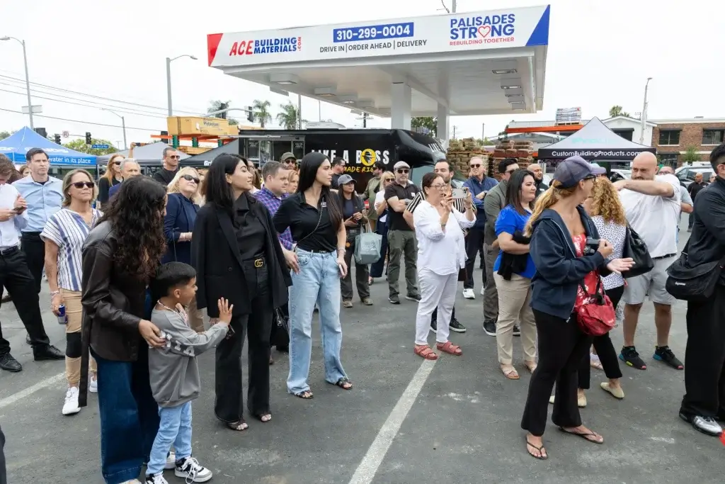 Community crowd gathered under the Ace Building Materials Palisades Strong canopy at the grand opening